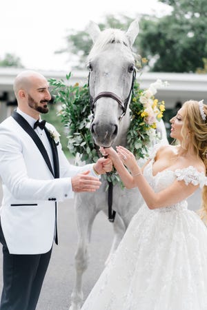 Krystyna and John Amalfe had horses at their wedding, held in Sept. 2021, to create an Amalfi Coats/fairytale wedding.