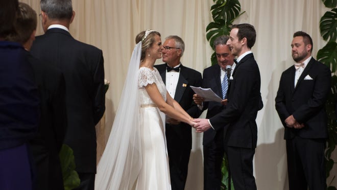 Clara Carrasco and Timothy Banik are married at Treasury on the Plaza on Saturday, July 22, 2017.