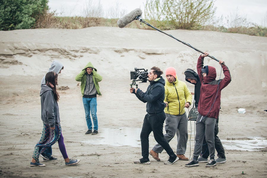 film crew recording outdoors